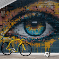 Urban street art eye mural decorating a modern loft room with yellow bicycle