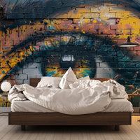 Graffiti eye wall mural used as a bold accent wall in a modern bedroom