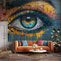 Street art graffiti eye mural with orange sofa in an eclectic modern living room