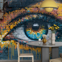 Urban graffiti eye wall mural creating a bold feature wall in a modern dining room