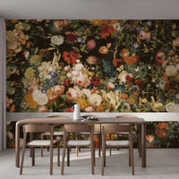 Colorful vintage floral wallpaper mural behind a wooden dining table and chairs