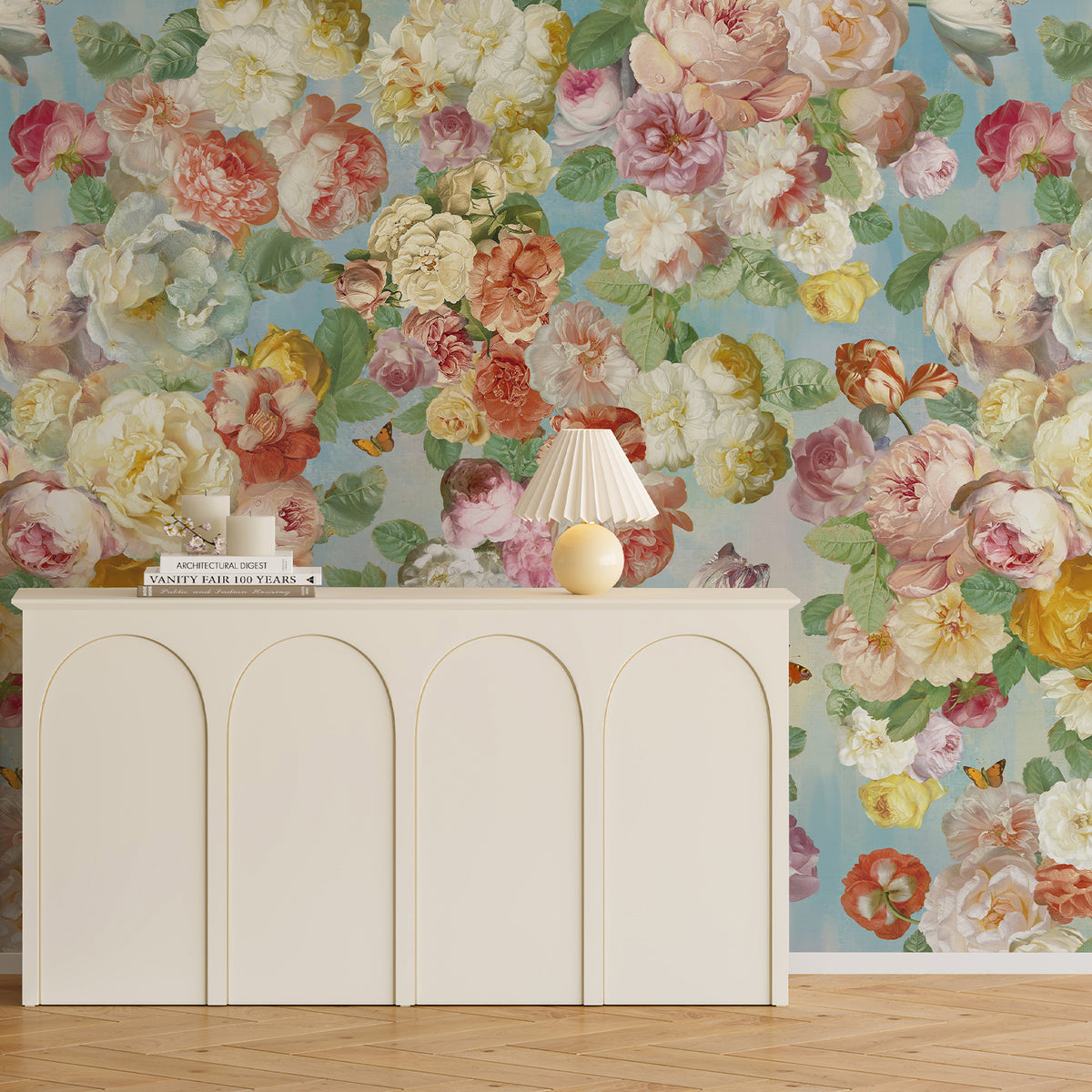 Colorful floral wallpaper mural on a blue-green background behind a white sideboard