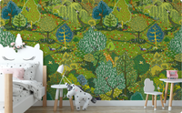 Illustrated green woodland wallpaper mural behind a white bed and small table