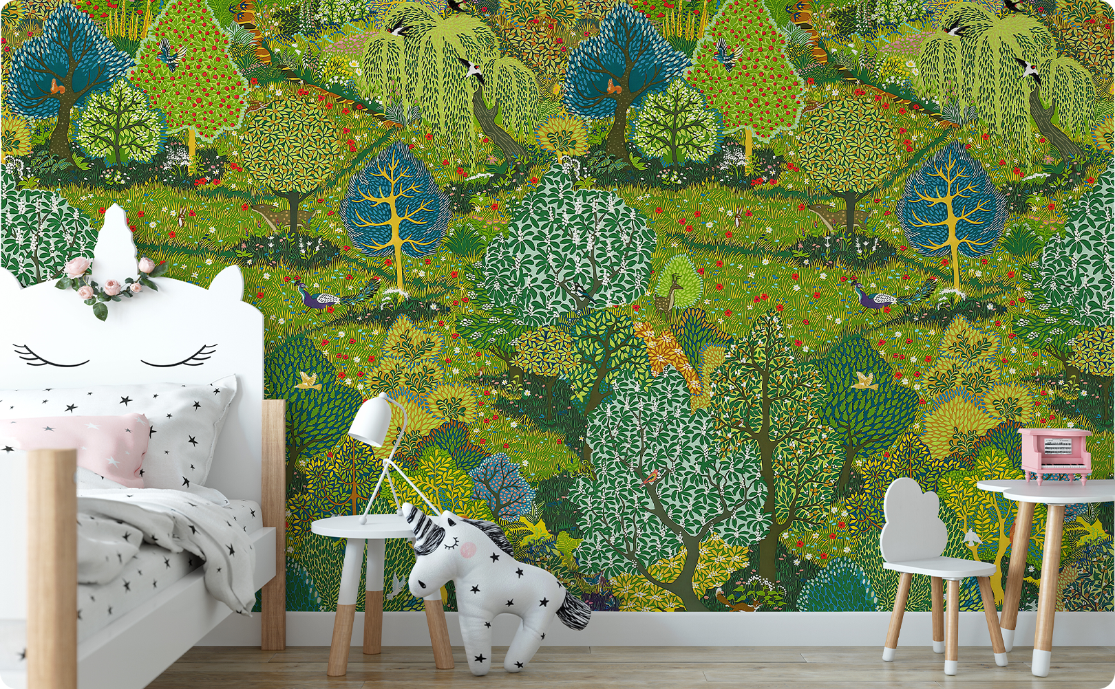 Illustrated green woodland wallpaper mural behind a white bed and small table