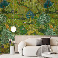 Detailed green forest wallpaper mural with patterned trees behind a cream curved sofa