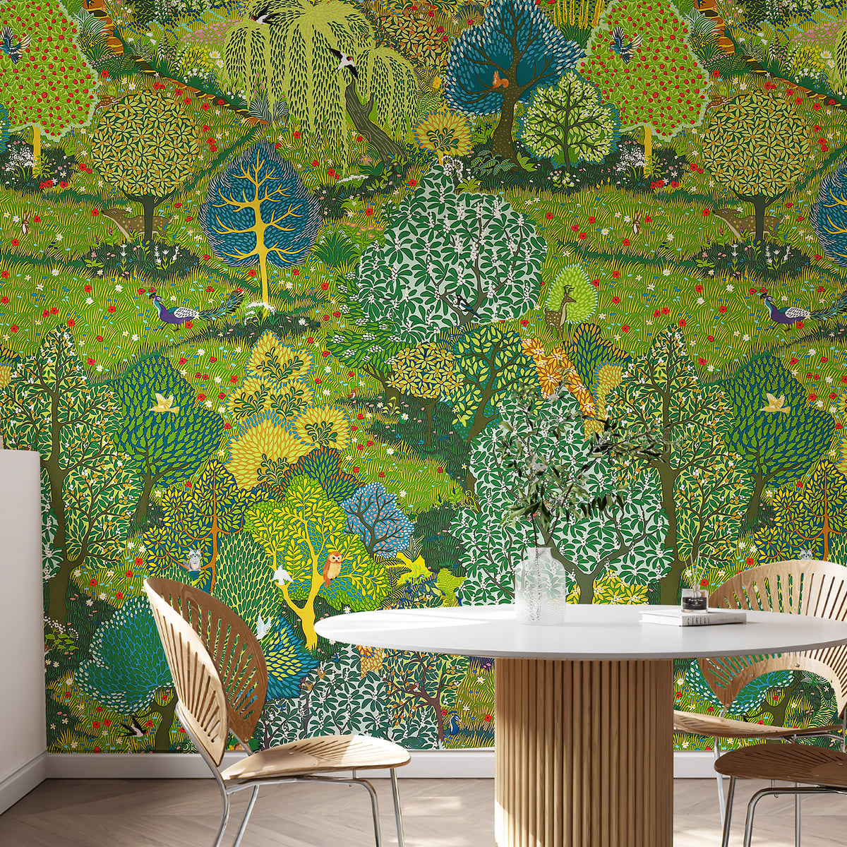 Illustrated green garden wallpaper mural behind a round dining table and wooden chairs