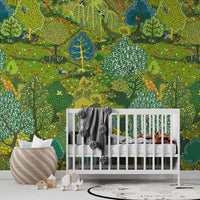 Green woodland garden wallpaper mural behind a white crib in a nursery