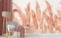 Peach pampas grass wallpaper mural behind a gray accent chair beside dusty rose curtains