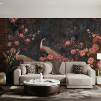 Peacock garden wall mural with dark botanical background behind a neutral sofa