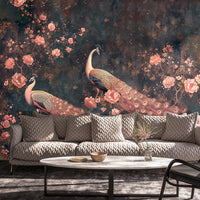Midnight peacock floral wall mural with pink blossoms behind a modern gray sofa