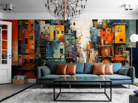Urban cityscape wall mural behind a blue sofa in a contemporary living room