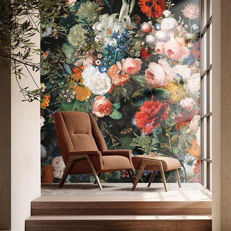 Vintage botanical garden wallpaper with colorful flowers installed in a cozy reading corner